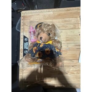 Plush Teddy Bear with Sunflower Dress and Bottle